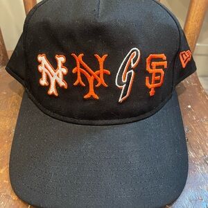 New Era Giants Mets Black and Orange Hat with Team Logo